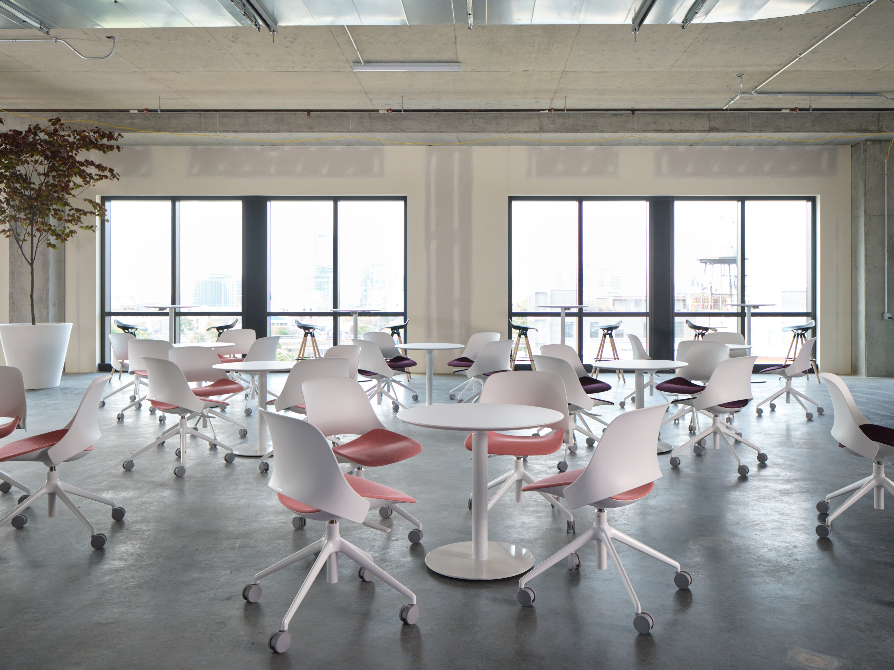 Environmental shot of Work Lounge space with Trea chairs and tables